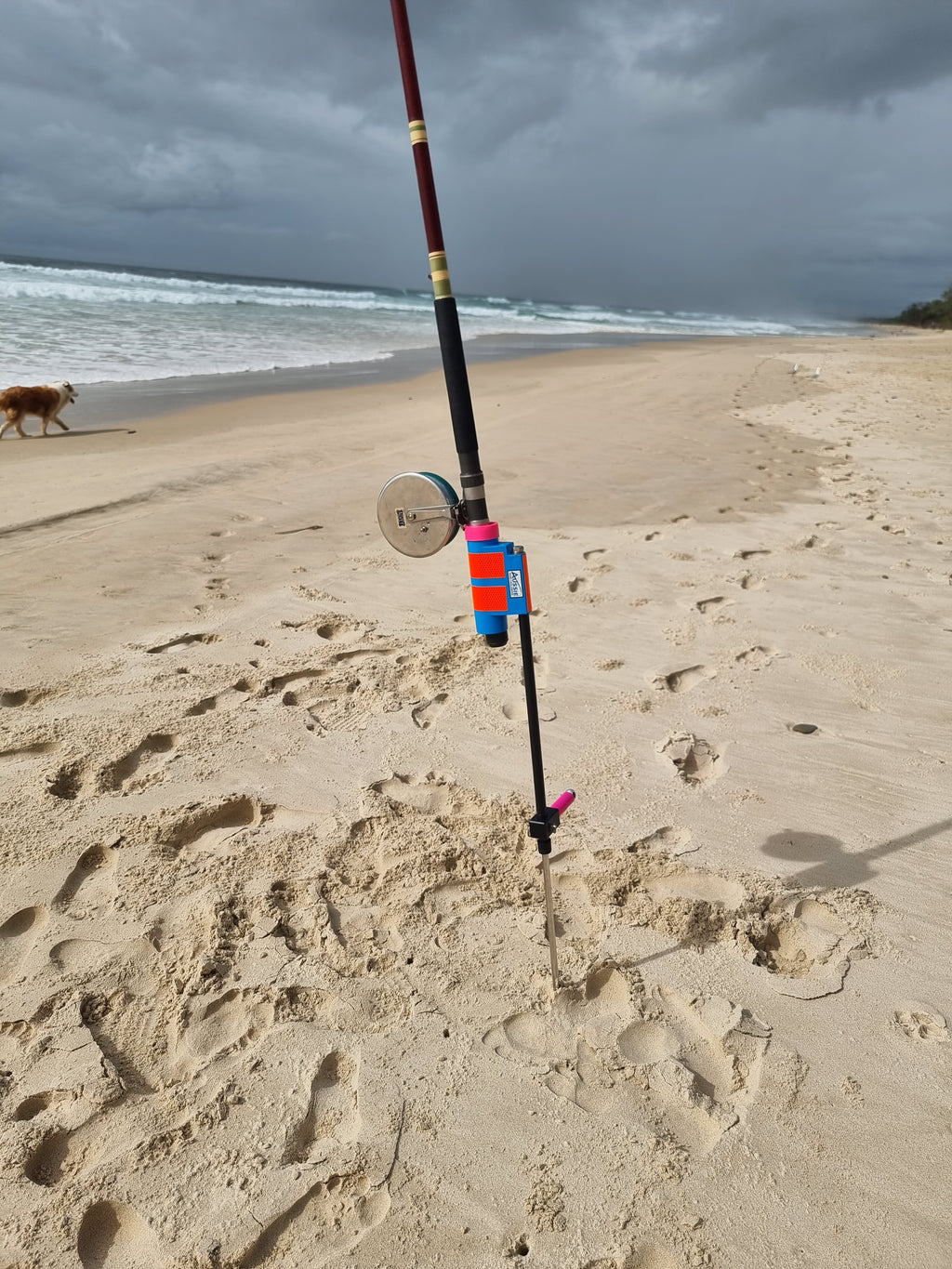 Surf Fishing rod holder on sandy beach with ocean in background
