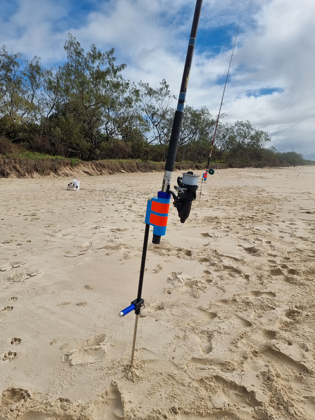 Beach fishing pole holders with sand spike