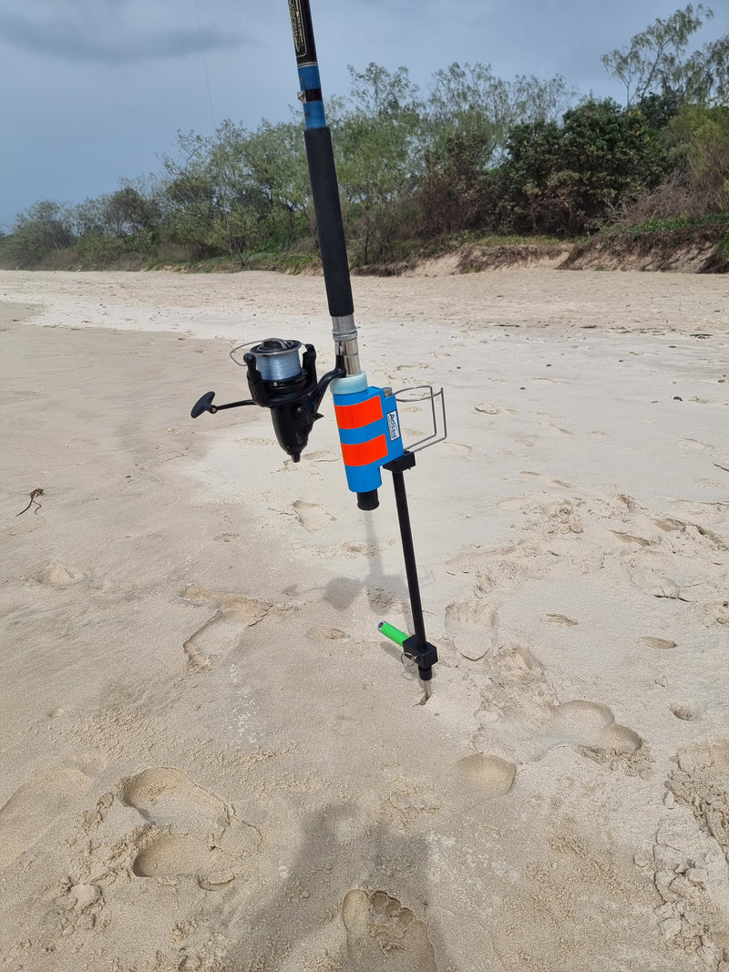 Fibreglass fishing rod holder with sand spike and drinks holder in beach