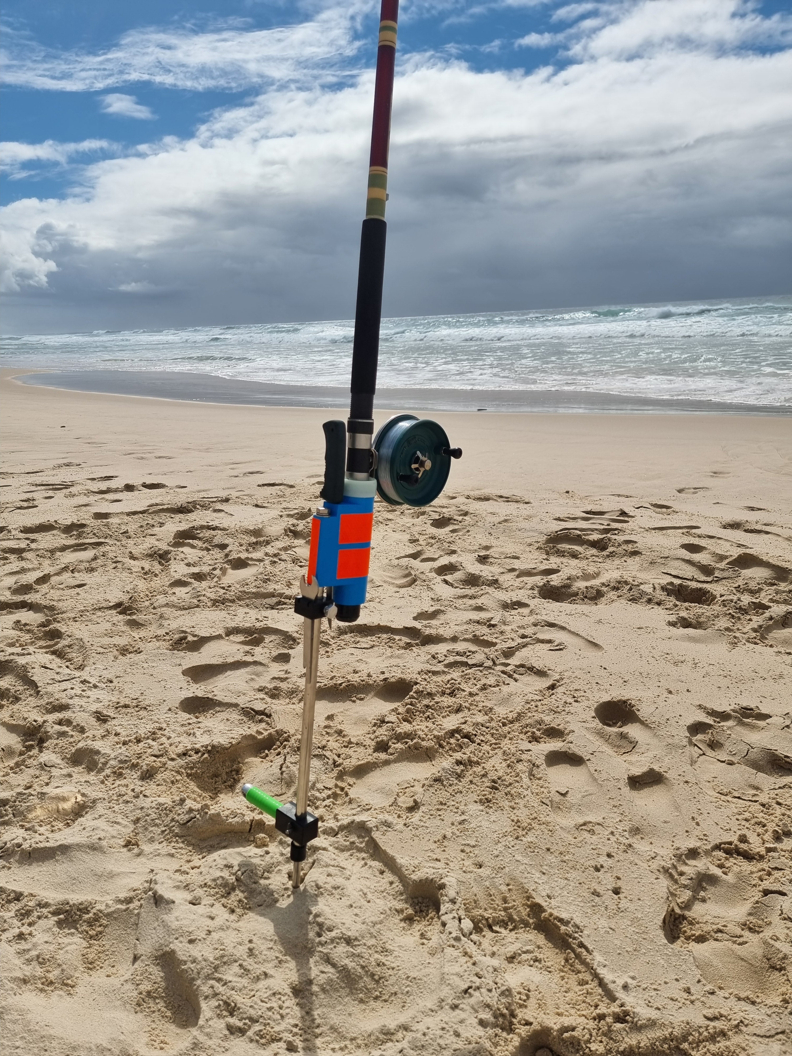 Fishing Rod and Reel in stainless steel beach fishing rod holder with knife