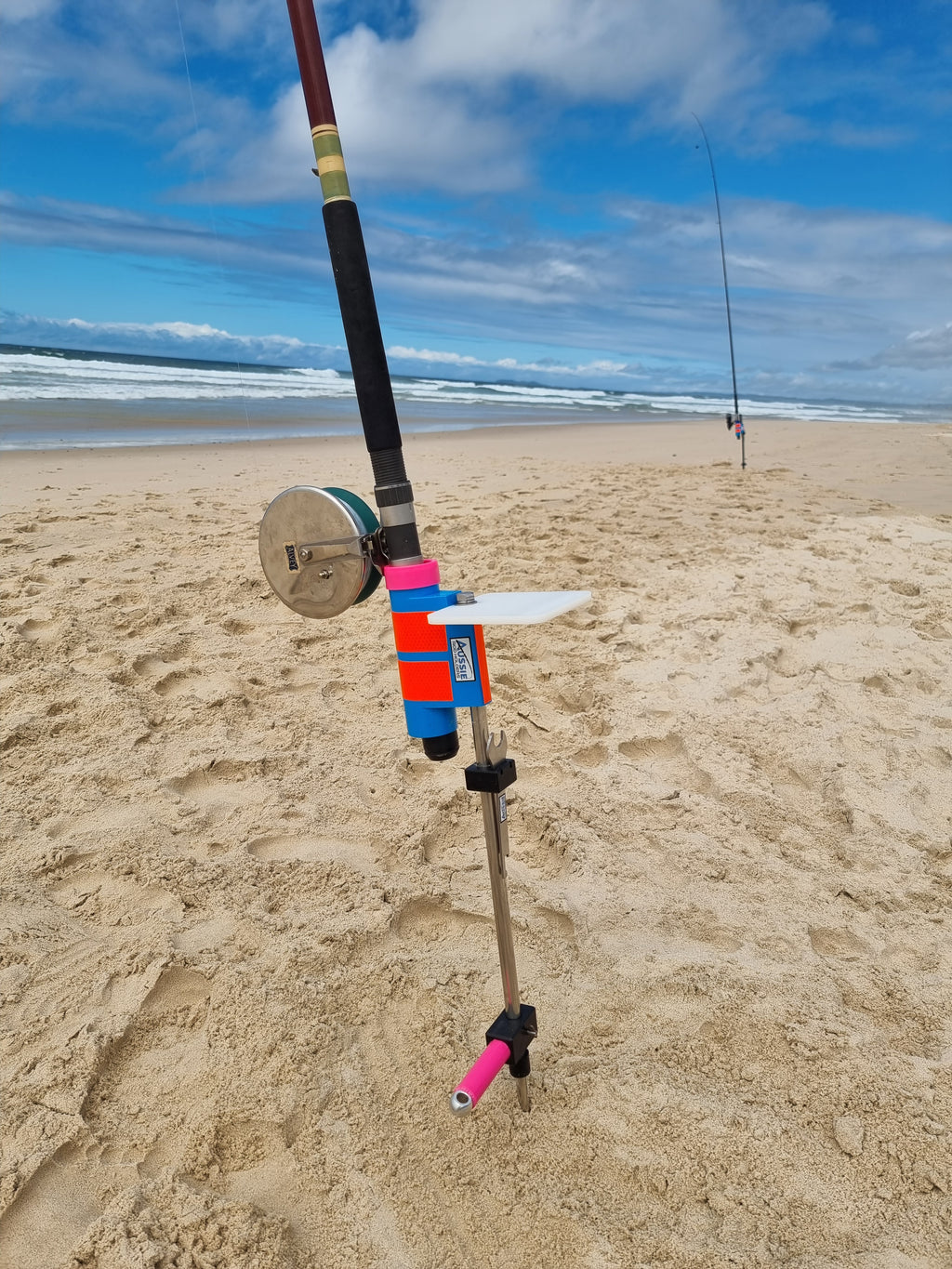 Snyder Glass rod in Stainless Steel rod holder with bait board on beach