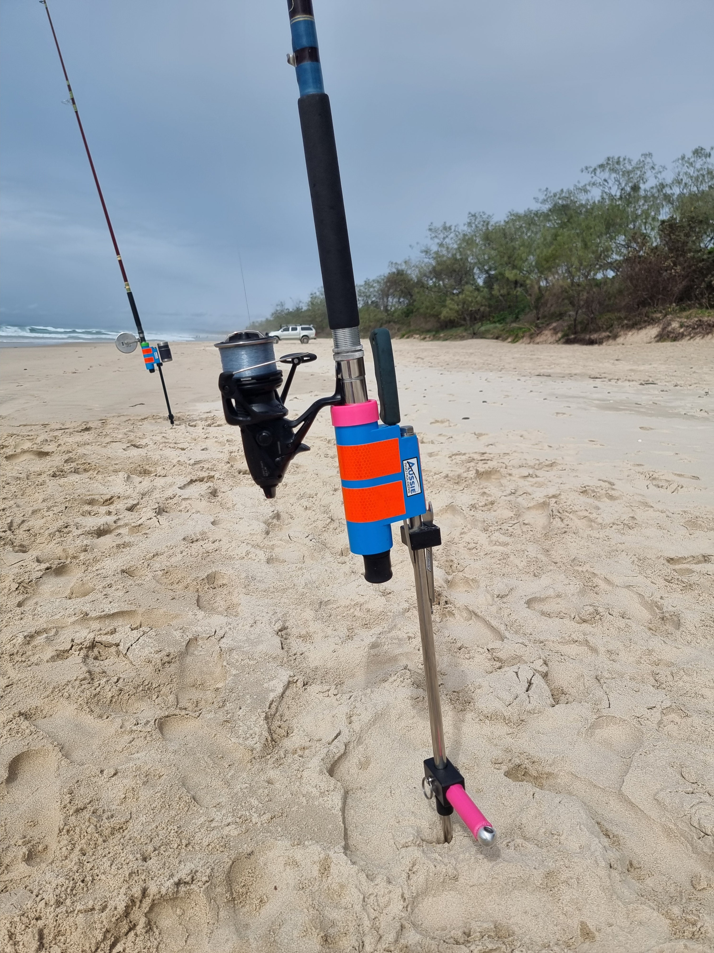 Stainless Steel beach Fishing Rod Holder with fishing knife and FWD in background