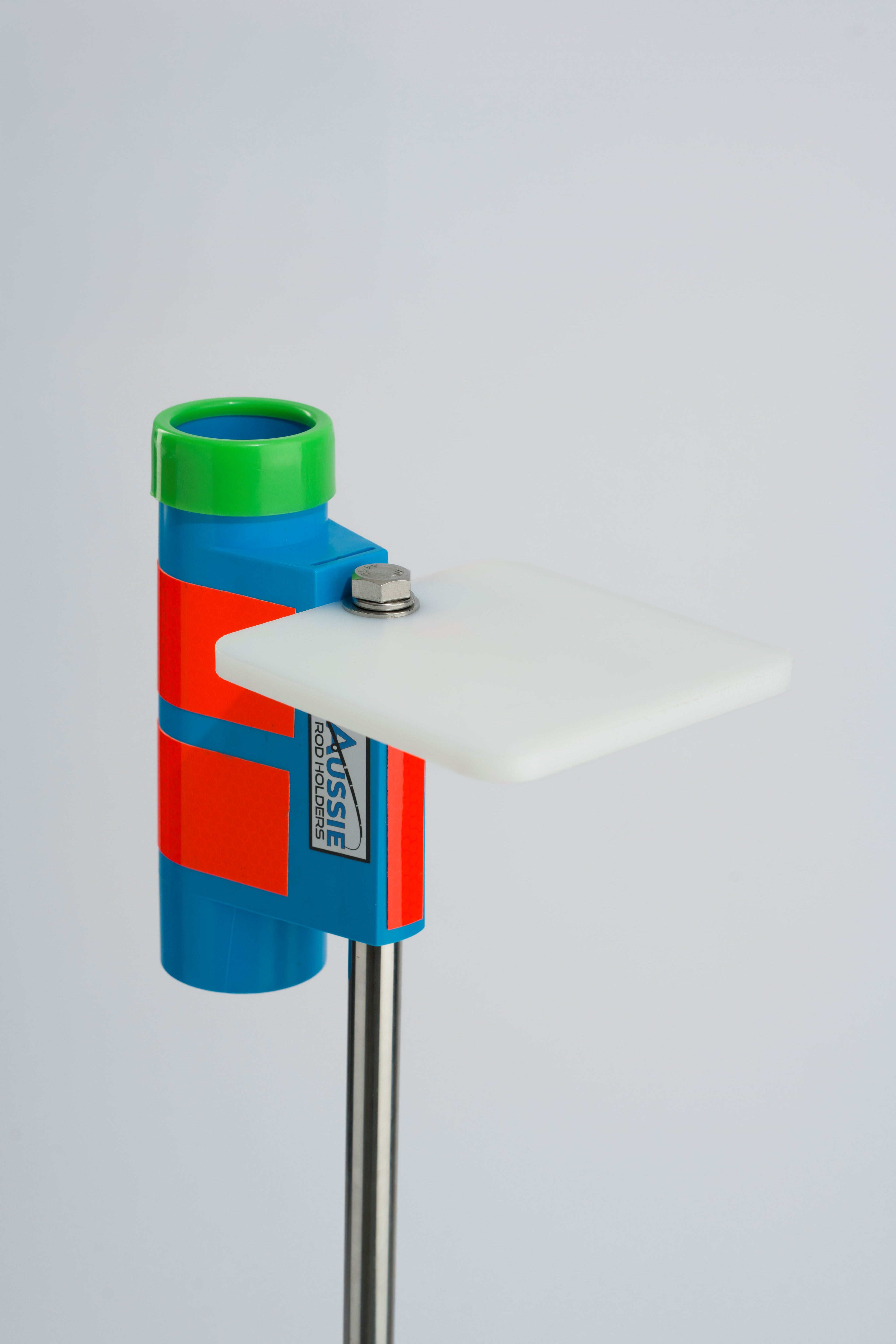 Blue and green fishing rod holder with white bait board attachment