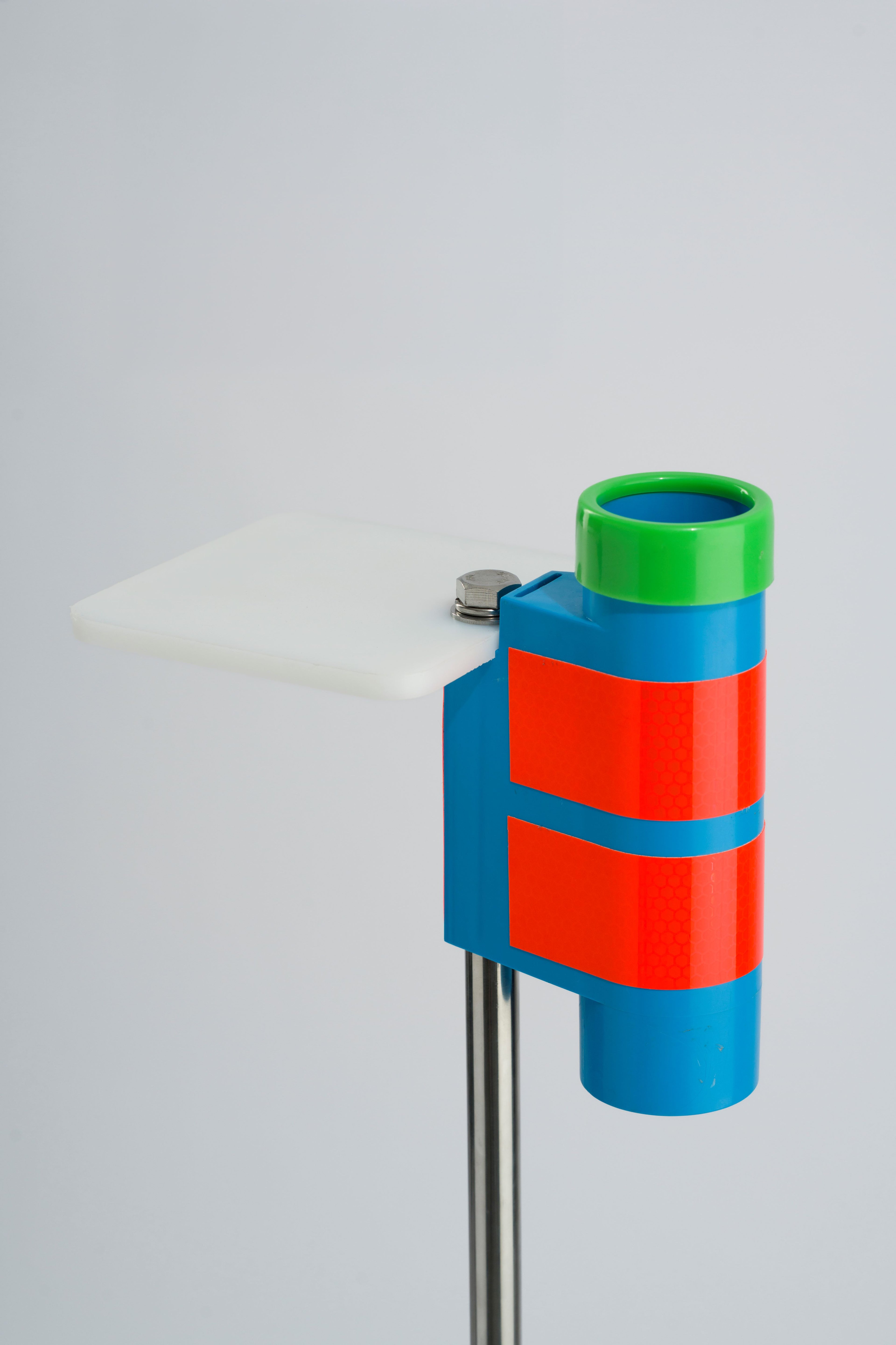 Blue and green fishing rod holder with white bait board attachment