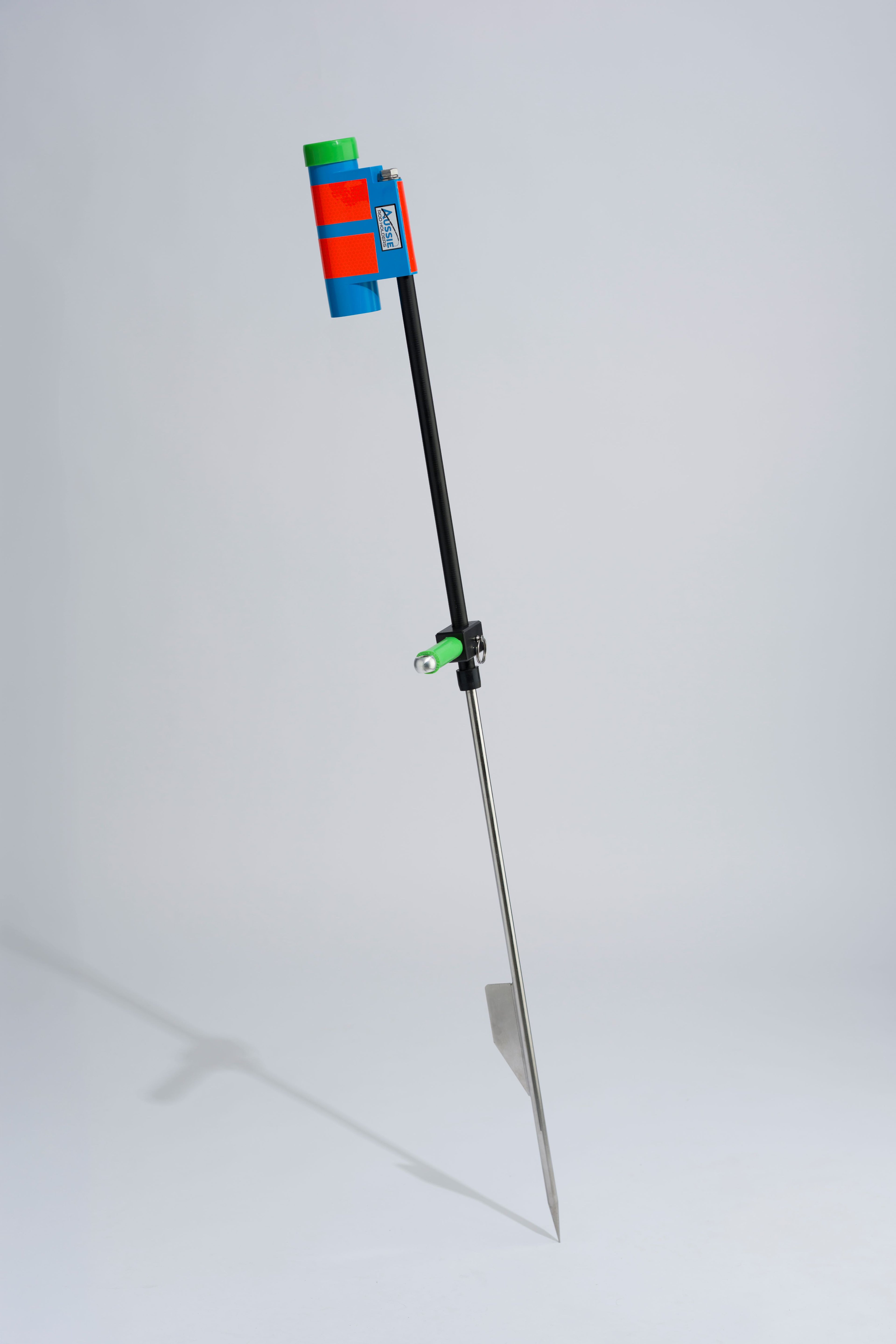 Blue and green fishing rod holder with fibreglass tube, foot peg and stainless steel sand spike on white background