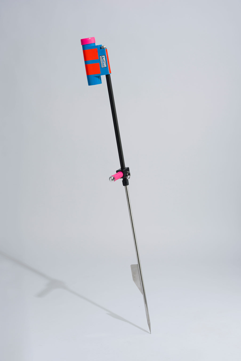 Blue and pink fishing rod holder with fibreglass tube, foot peg and stainless steel sand spike on white background