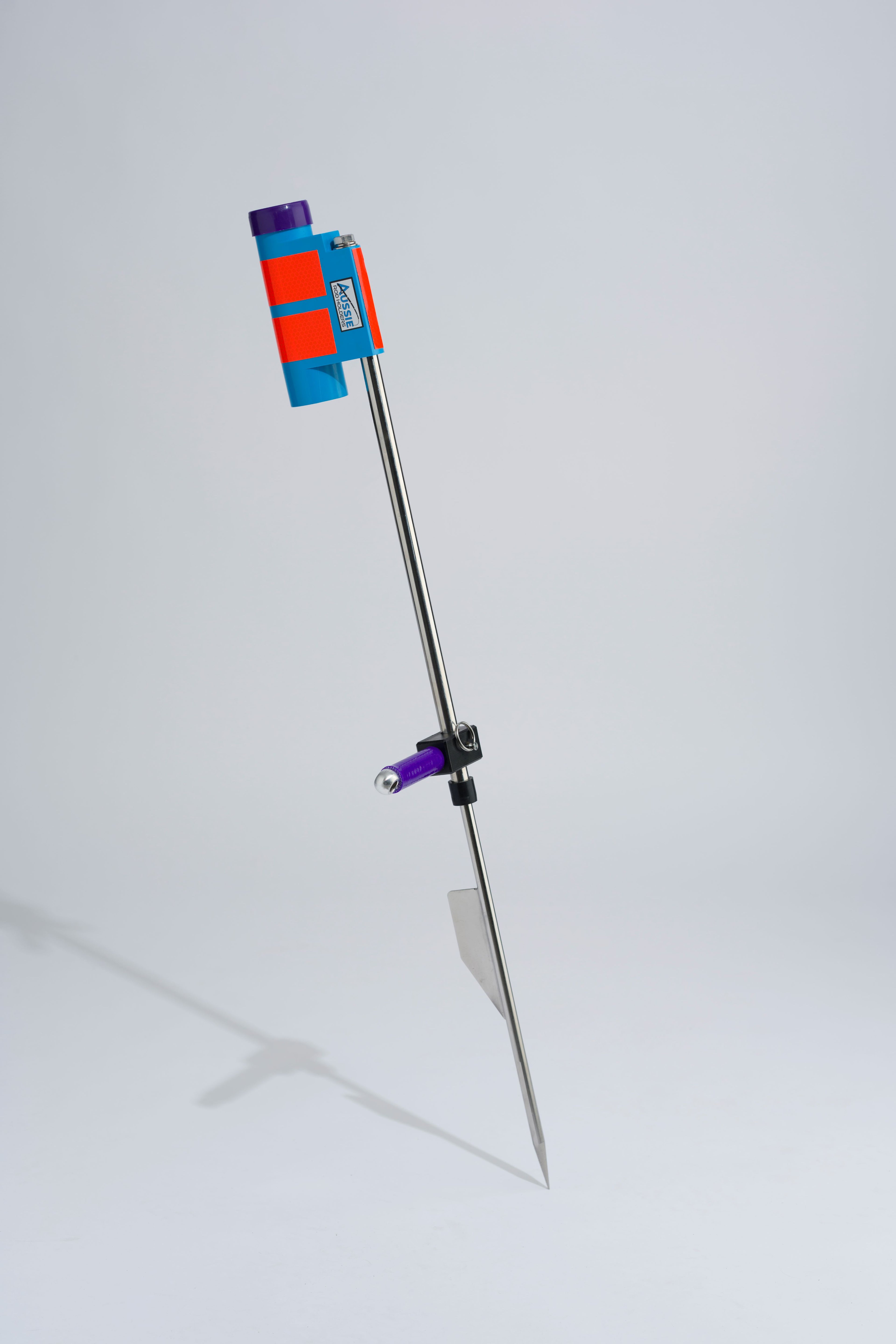 Blue and purple fishing rod holder with foot peg and stainless steel sand spike on white background